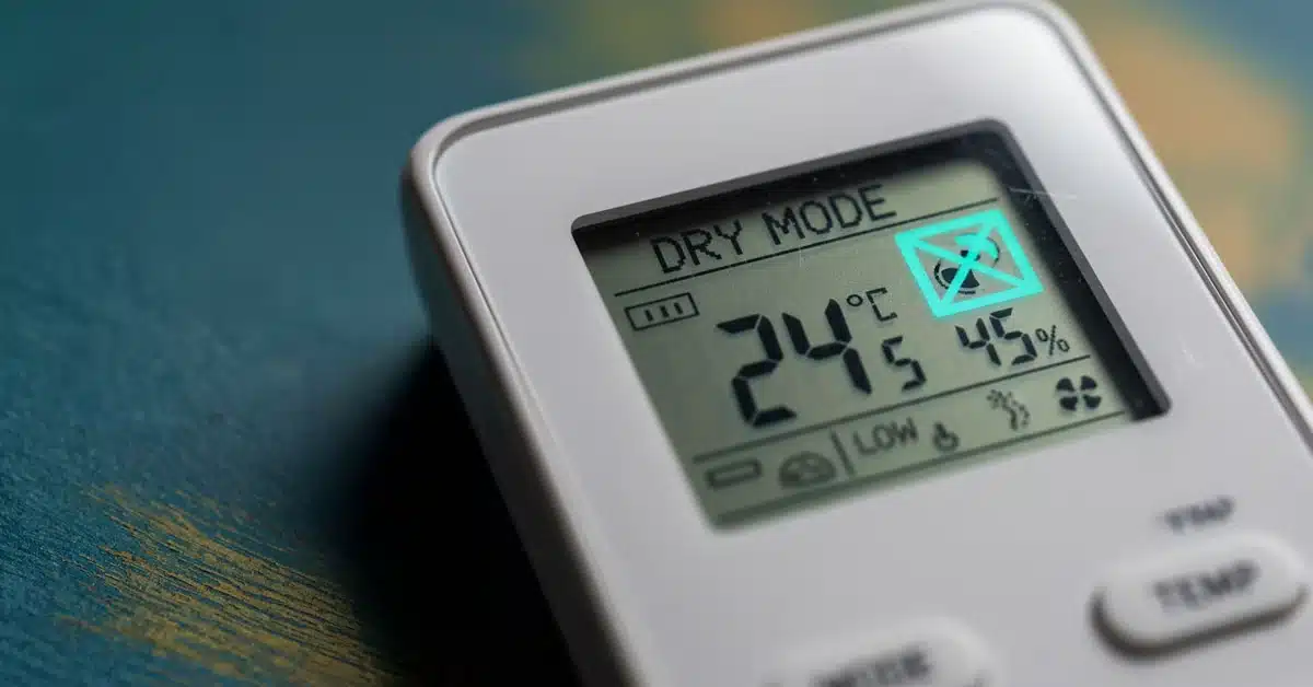 Air Conditioner Remote Displaying Dry Mode and Temperature Close-up of an air conditioner remote control screen displaying "DRY MODE.